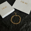 Gold chain bracelet with linked oval links and Dior clasp