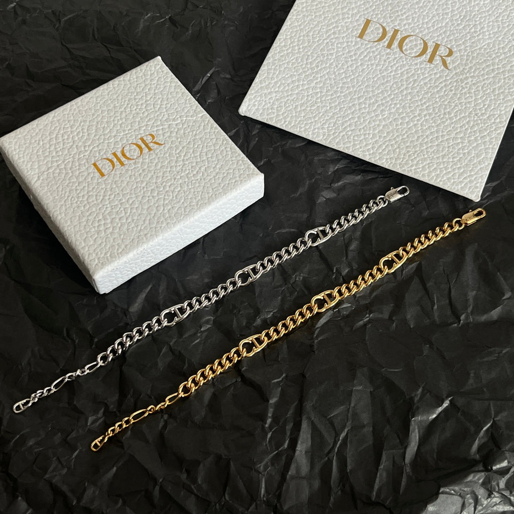 Gold chain bracelet with alternating links and Dior hoop clasp