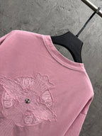 Pink short-sleeve T-shirt with cross-like back embroidery detail