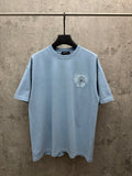Light blue T-shirt with crew neck and small chest crest embroidery