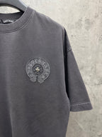 Dark gray crew-neck T-shirt with small circular chest crest logo on front