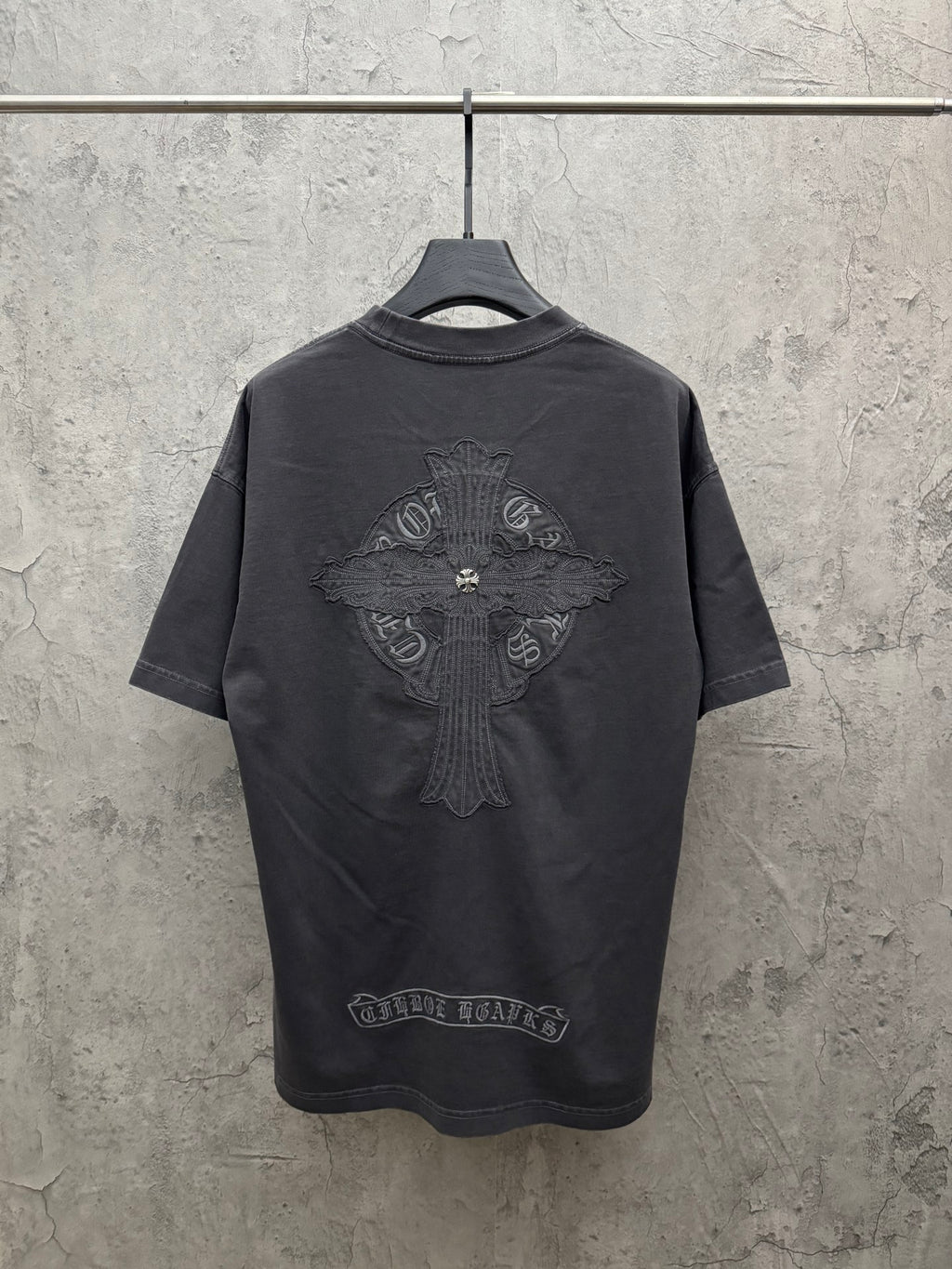 Dark gray crew-neck T-shirt with large winged crest graphic embroidery