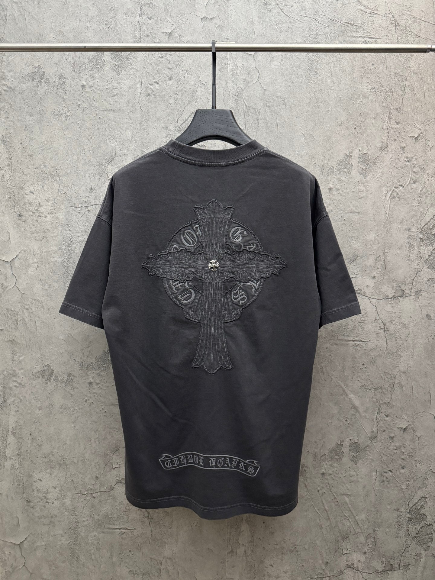 Dark gray crew-neck T-shirt with large winged crest graphic embroidery