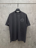 Dark gray crew-neck T-shirt with small circular embroidered chest crest