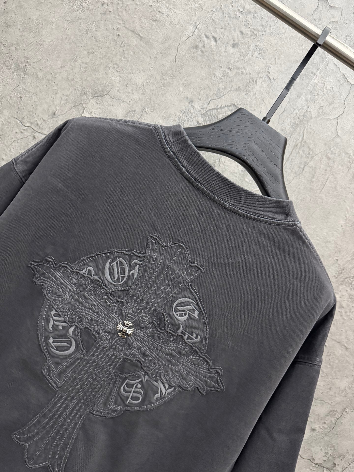 Dark gray crew-neck T-shirt with large winged cross embroidery detail