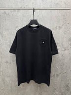 Crewneck short-sleeve T-shirt in dark color with small chest emblem patch