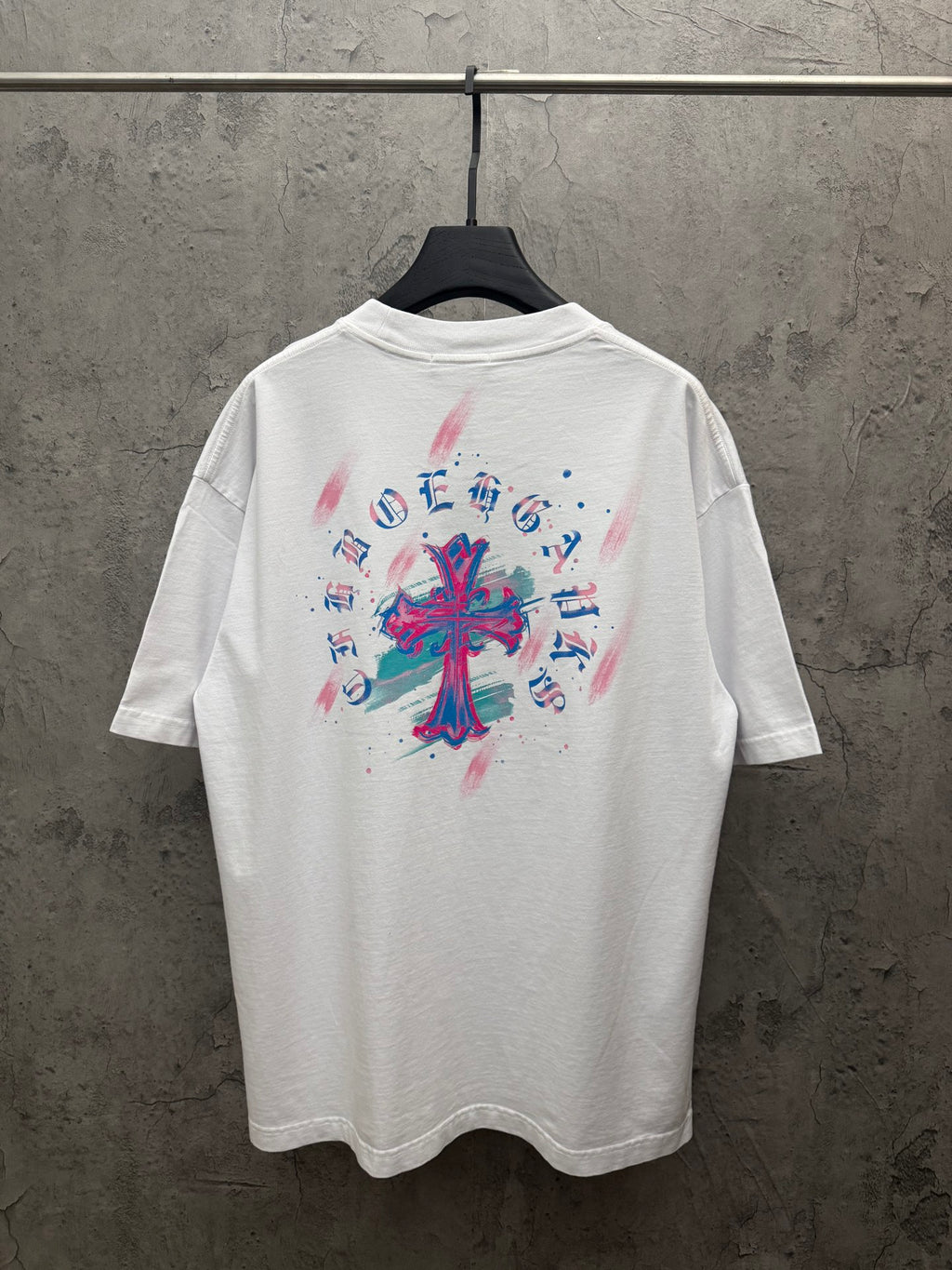 White graphic T-shirt with colorful back cross-style print