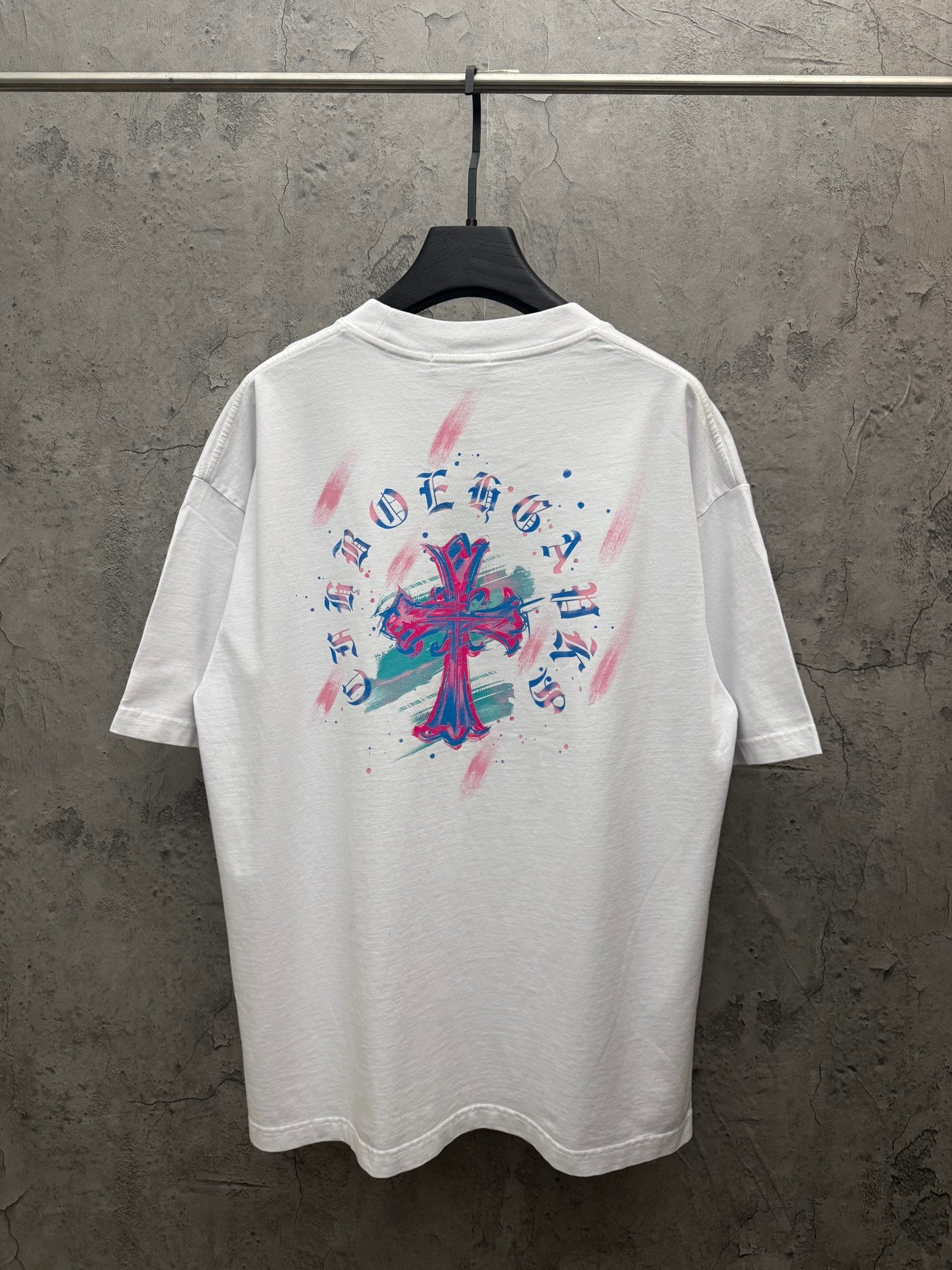 White graphic T-shirt with colorful back cross-style print