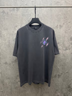 Dark gray short-sleeve T-shirt with small colorful cross graphic at chest