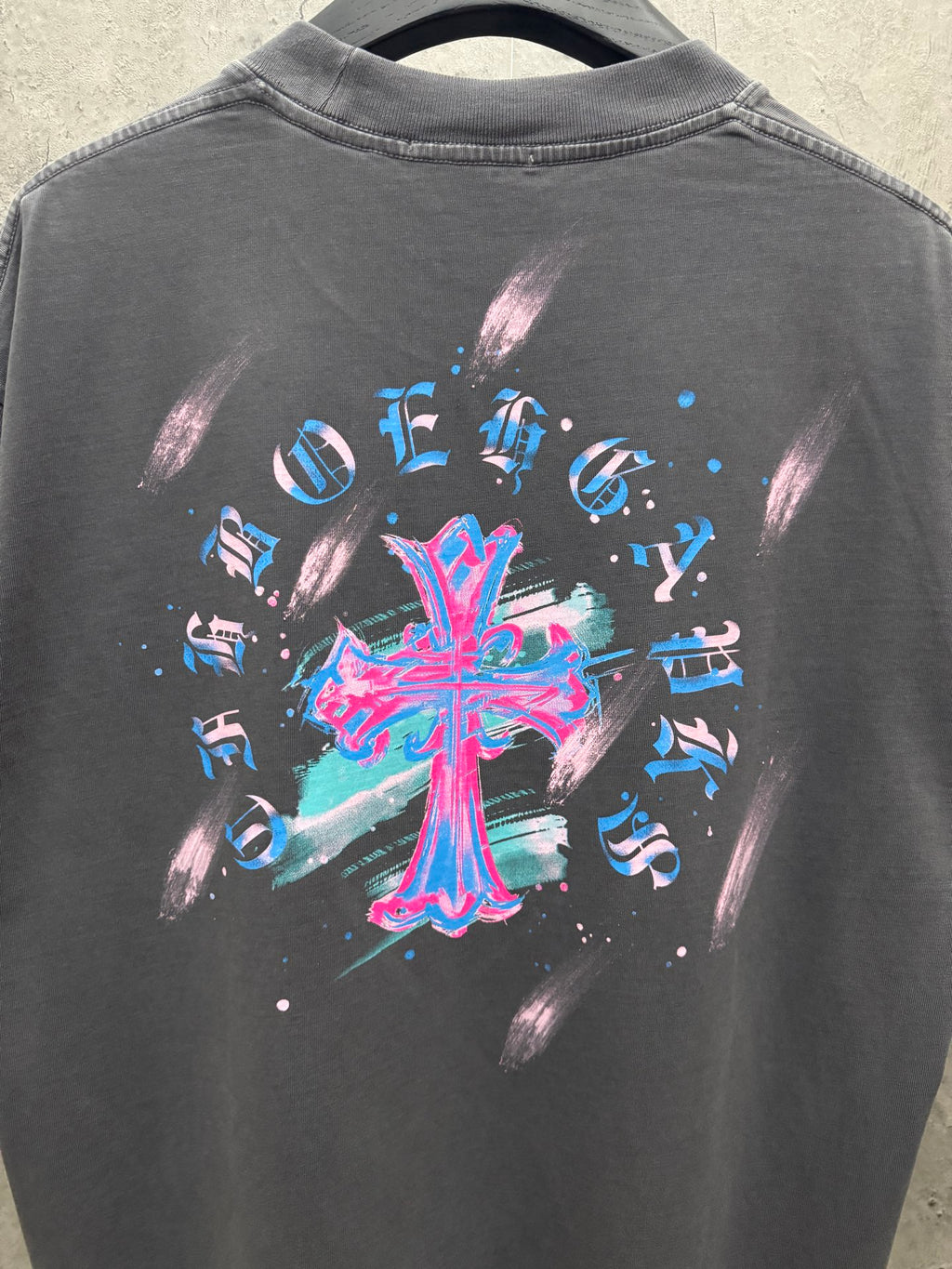 Dark gray short-sleeve T-shirt back view with large colorful cross graphic