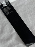 Black fabric care tag with size and text on Balenciaga T-shirt