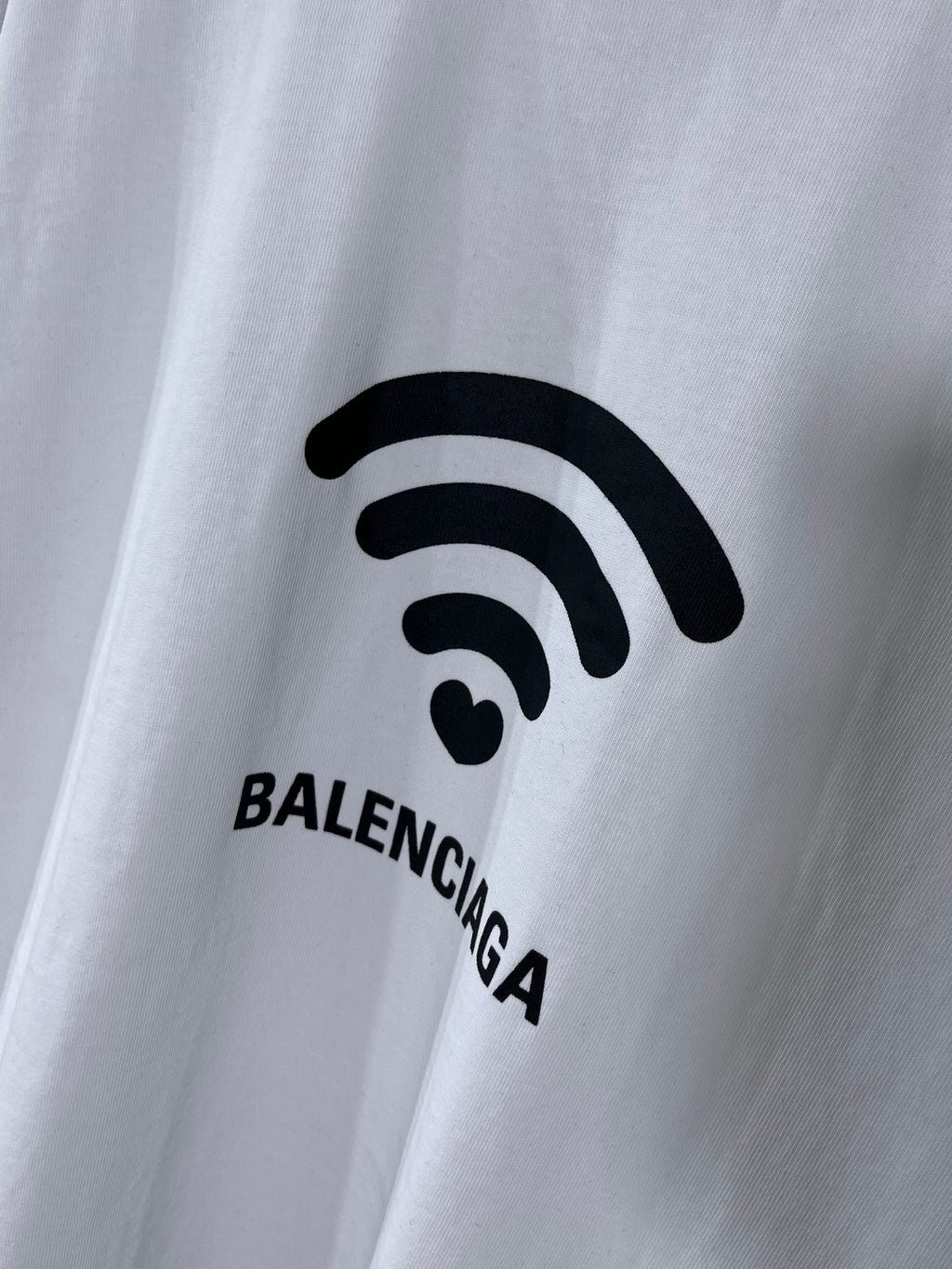 White Balenciaga T-shirt with Wi-Fi heart graphic and BALENCIAGA text