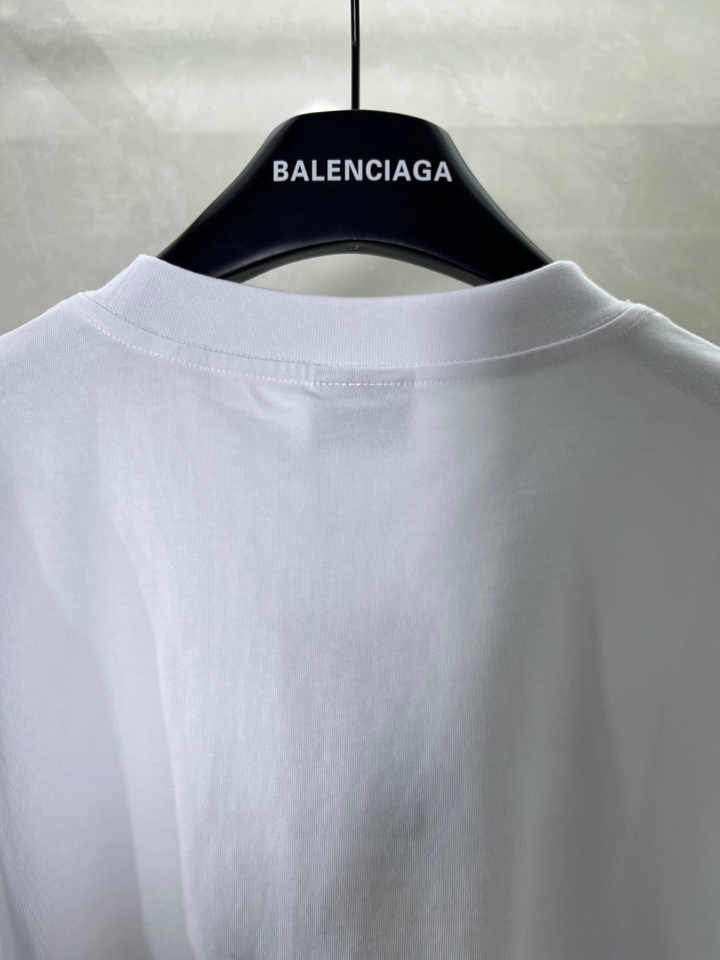 White Balenciaga T-shirt back view with BALENCIAGA neck label