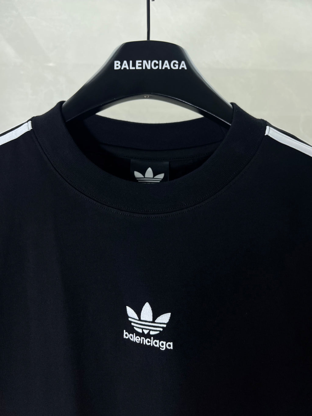 Short-sleeve T-shirt close-up: crew neck and small chest logo