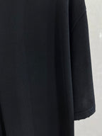 Balenciaga black short-sleeve top with structured shoulder and sleeve