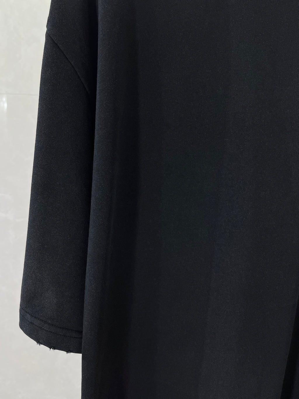 Balenciaga black short-sleeve top, draped side seam and hem