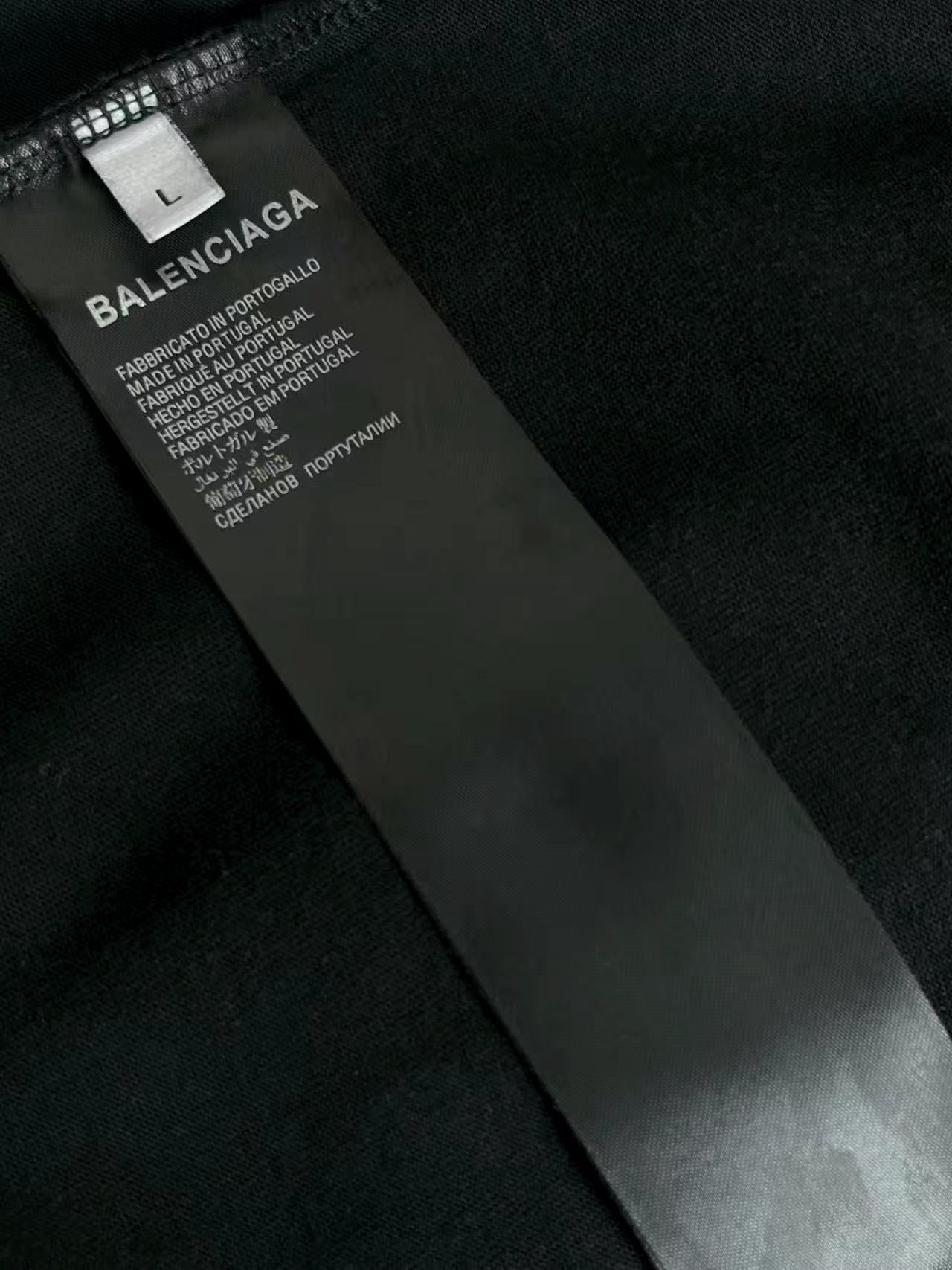 Black garment label with size L and Balenciaga text, care information.