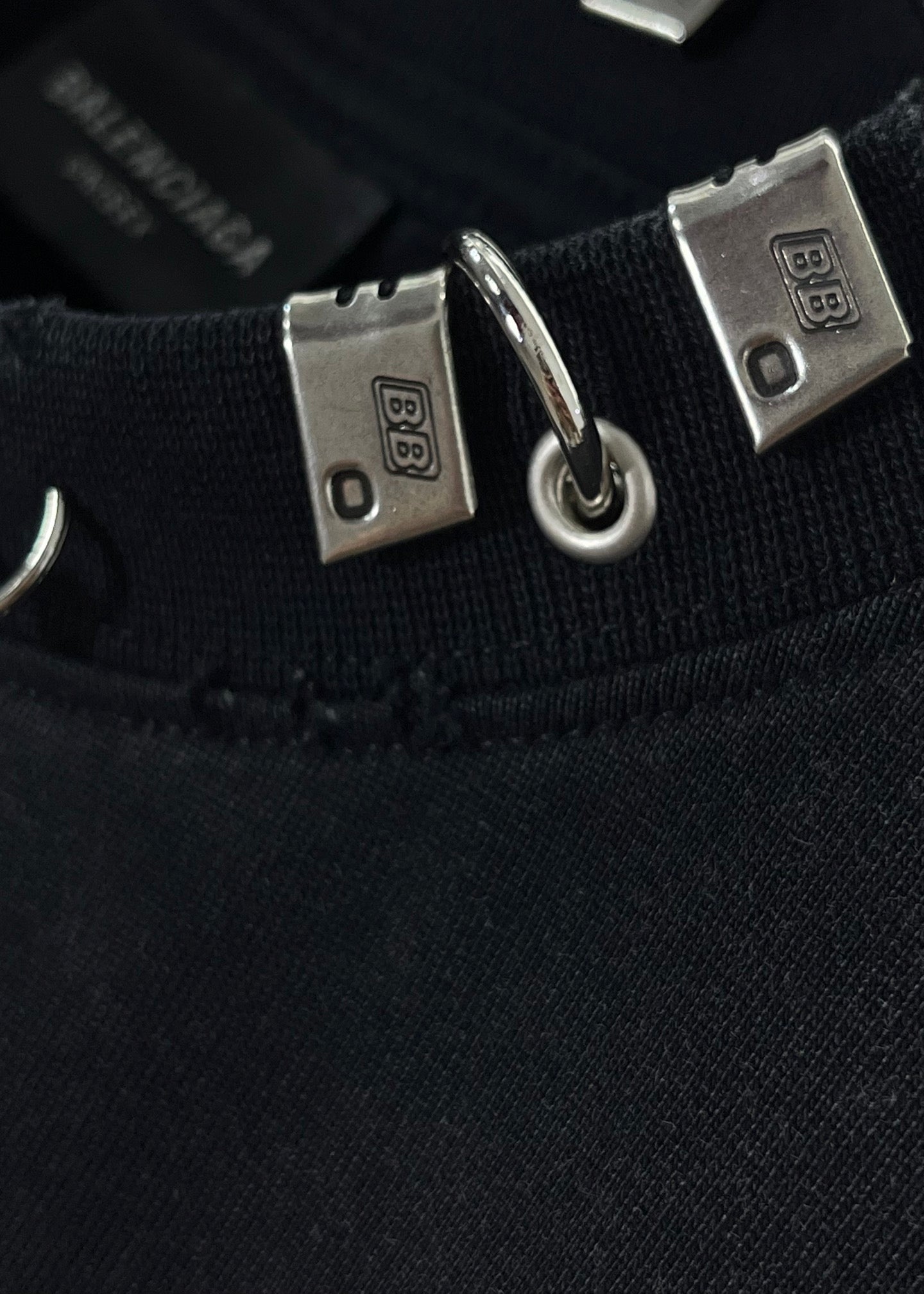 Balenciaga black crewneck top with square metal hardware and rings
