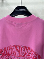 Pink Balenciaga crew-neck T-shirt with red logo-style graphic on the front