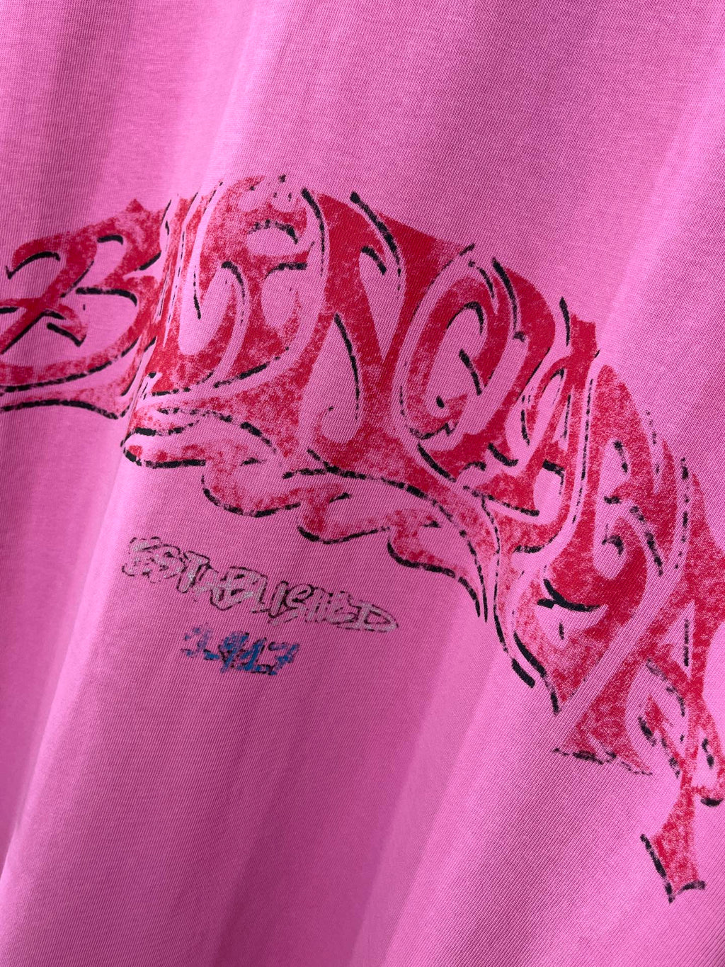 Pink Balenciaga T-shirt with close-up red graphic lettering print