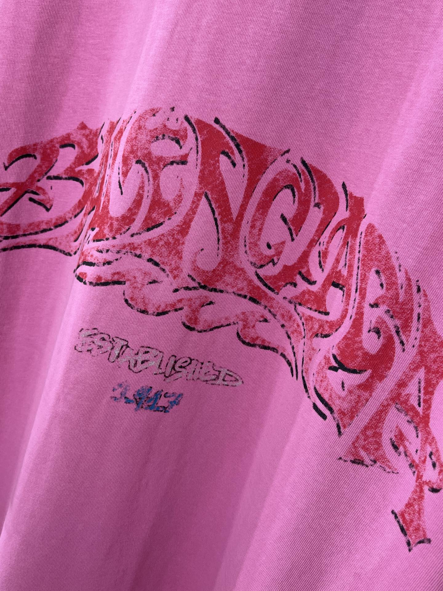 Pink Balenciaga T-shirt with close-up red graphic lettering print