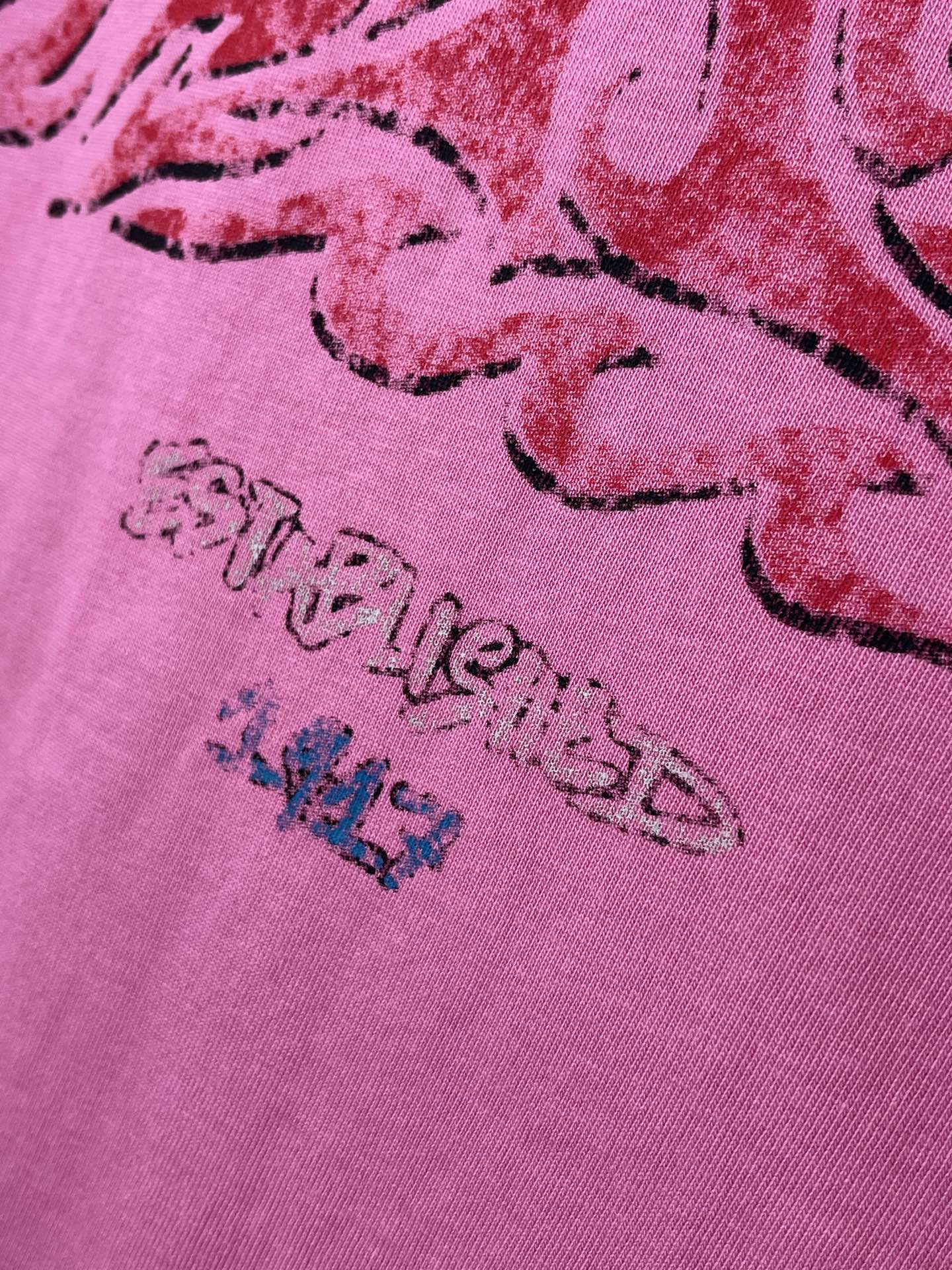 Pink Balenciaga T-shirt with detailed red script graphic print