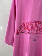Pink Balenciaga T-shirt with large red graphic print across the front
