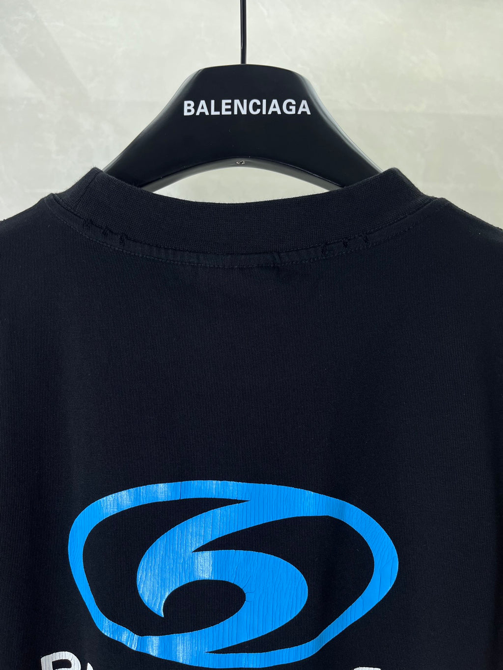 Black Balenciaga T-shirt back view with blue logo graphic