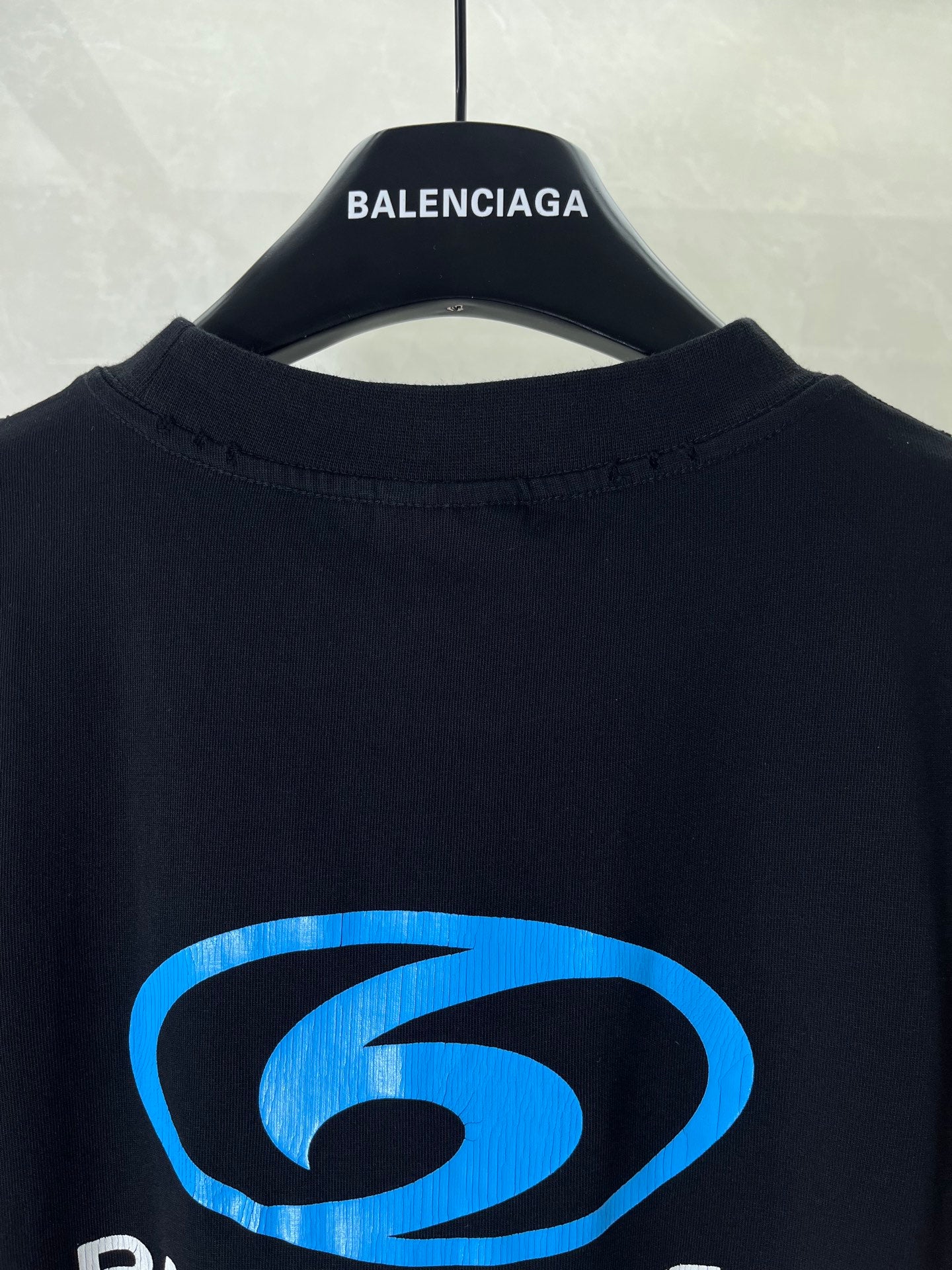 Black Balenciaga T-shirt back view with blue logo graphic