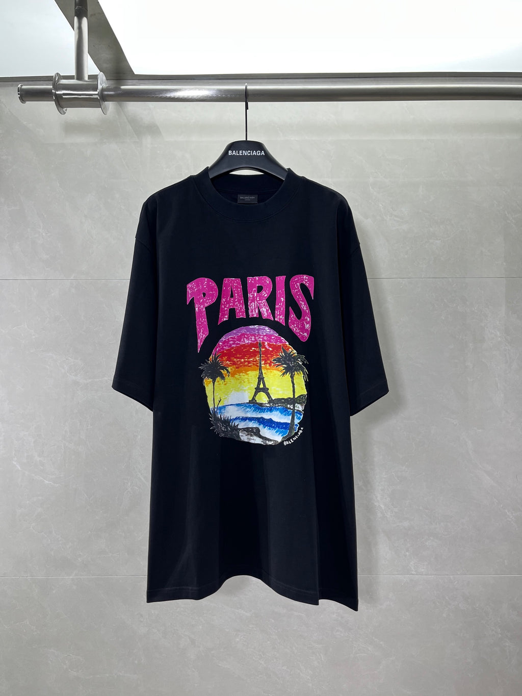 Balenciaga black T-shirt with pink PARIS logo and colorful beach graphic