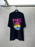 Balenciaga black T-shirt with pink PARIS logo and colorful beach graphic