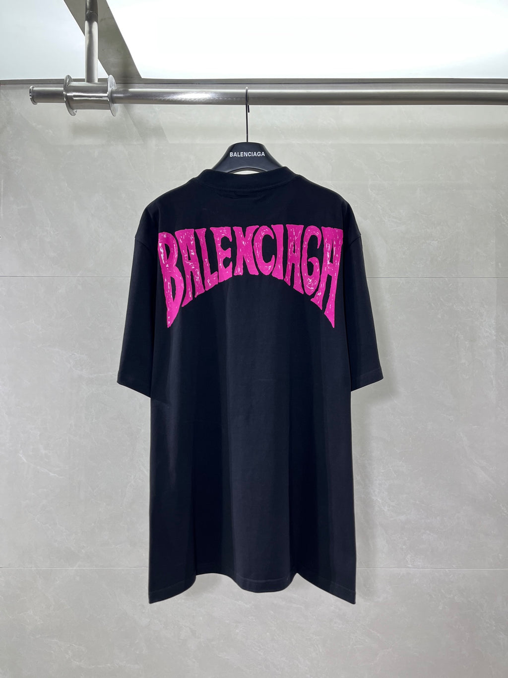 Balenciaga black T-shirt with pink BALENCIAGA text graphic on back