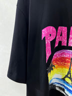 Balenciaga black T-shirt with partial pink PARIS text and colorful scene print