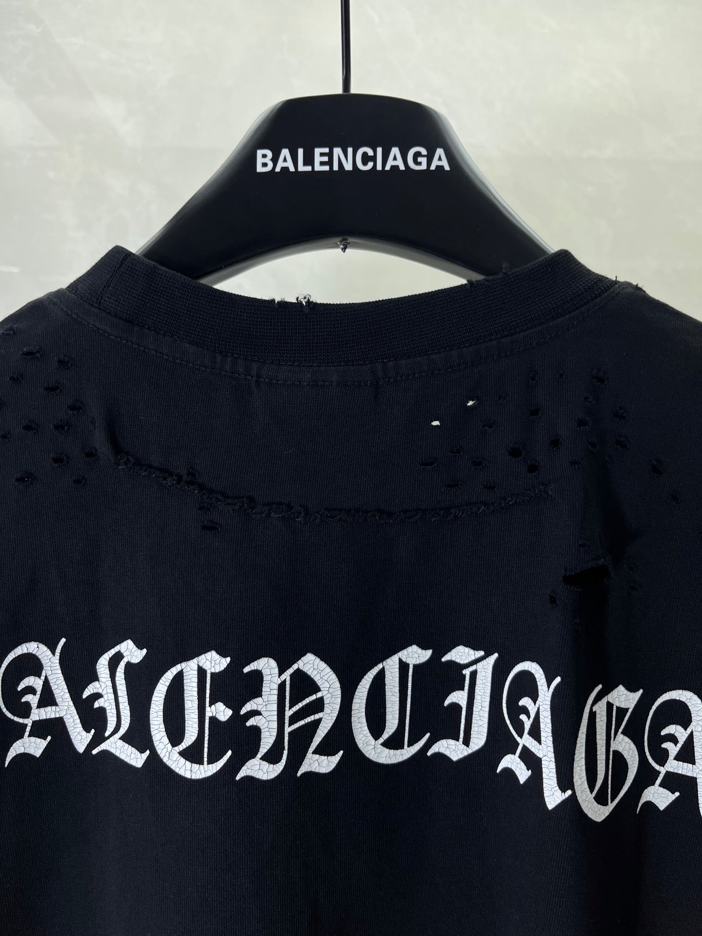 Balenciaga black T-shirt back with distressed logo across the upper section