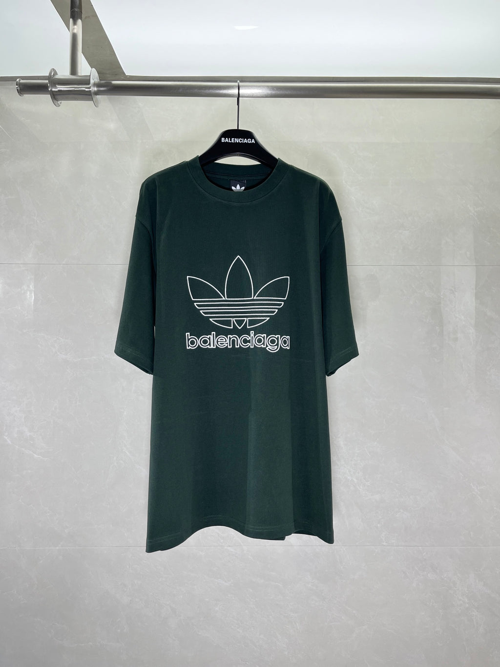 Dark green T-shirt with adidas trefoil and Balenciaga wordmark print on front
