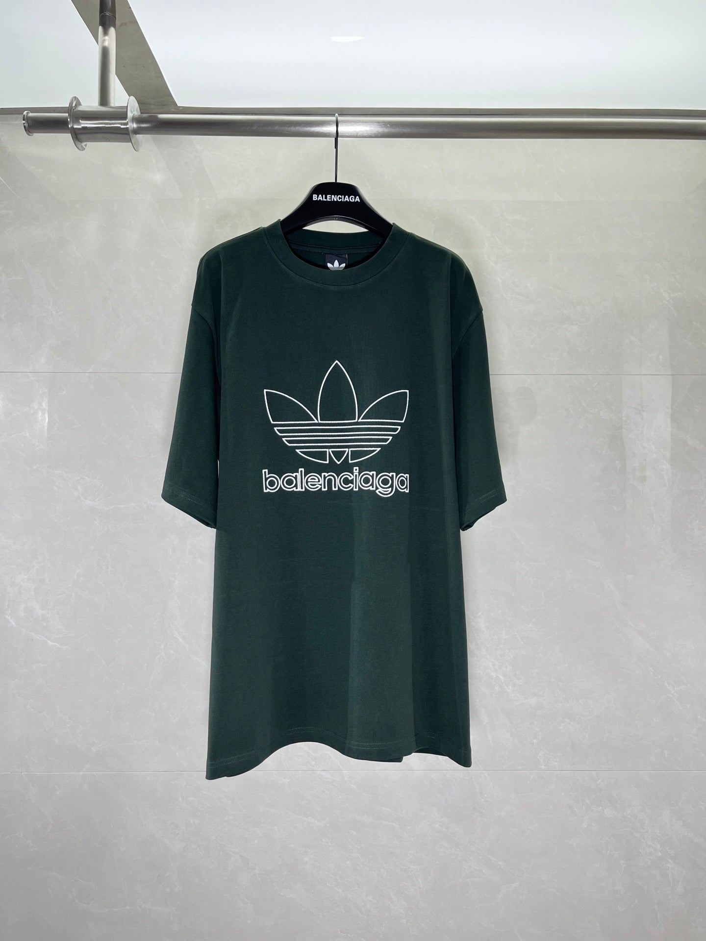 Dark green T-shirt with adidas trefoil and Balenciaga wordmark print on front