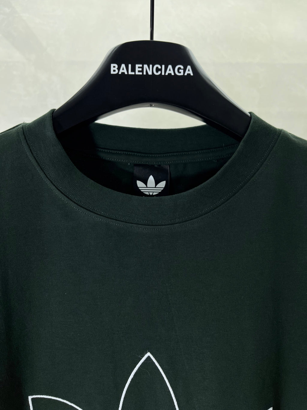 Dark green T-shirt crew neck with small adidas trefoil logo at neckline