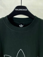 Dark green T-shirt crew neck with small adidas trefoil logo at neckline