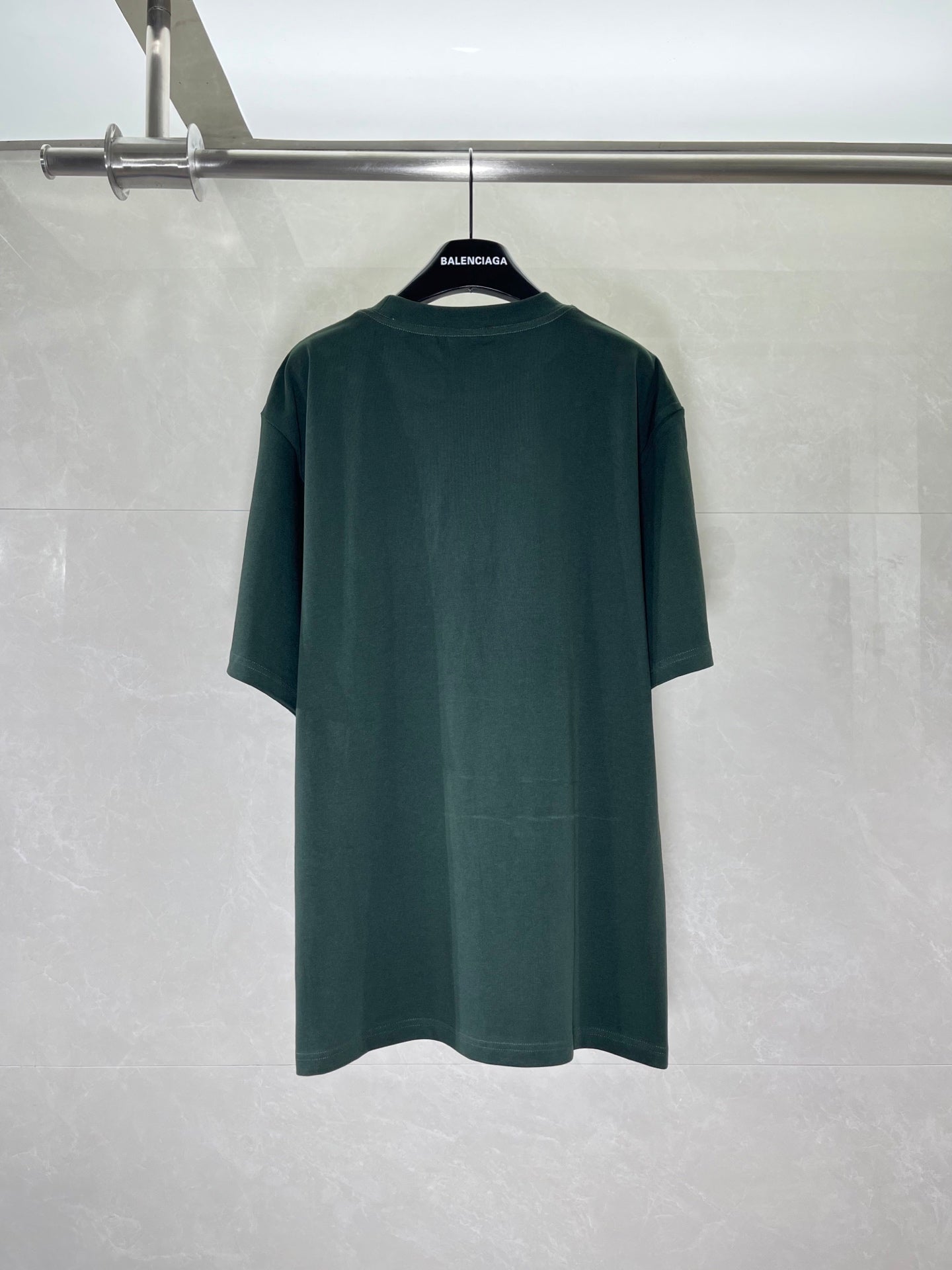 Dark green T-shirt back view with short sleeves and relaxed fit