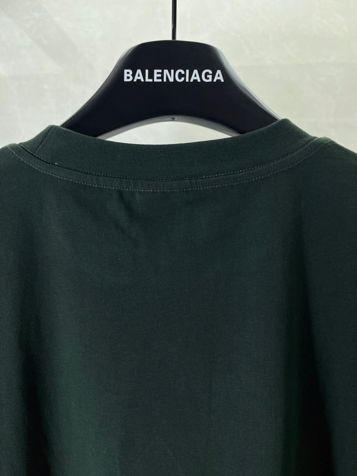 Dark green T-shirt back with crew neck and clean plain upper panel