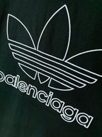 Dark green T-shirt chest graphic with adidas trefoil and striped logo in white