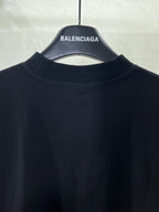 Balenciaga T-shirt collar and upper back area on dark fabric
