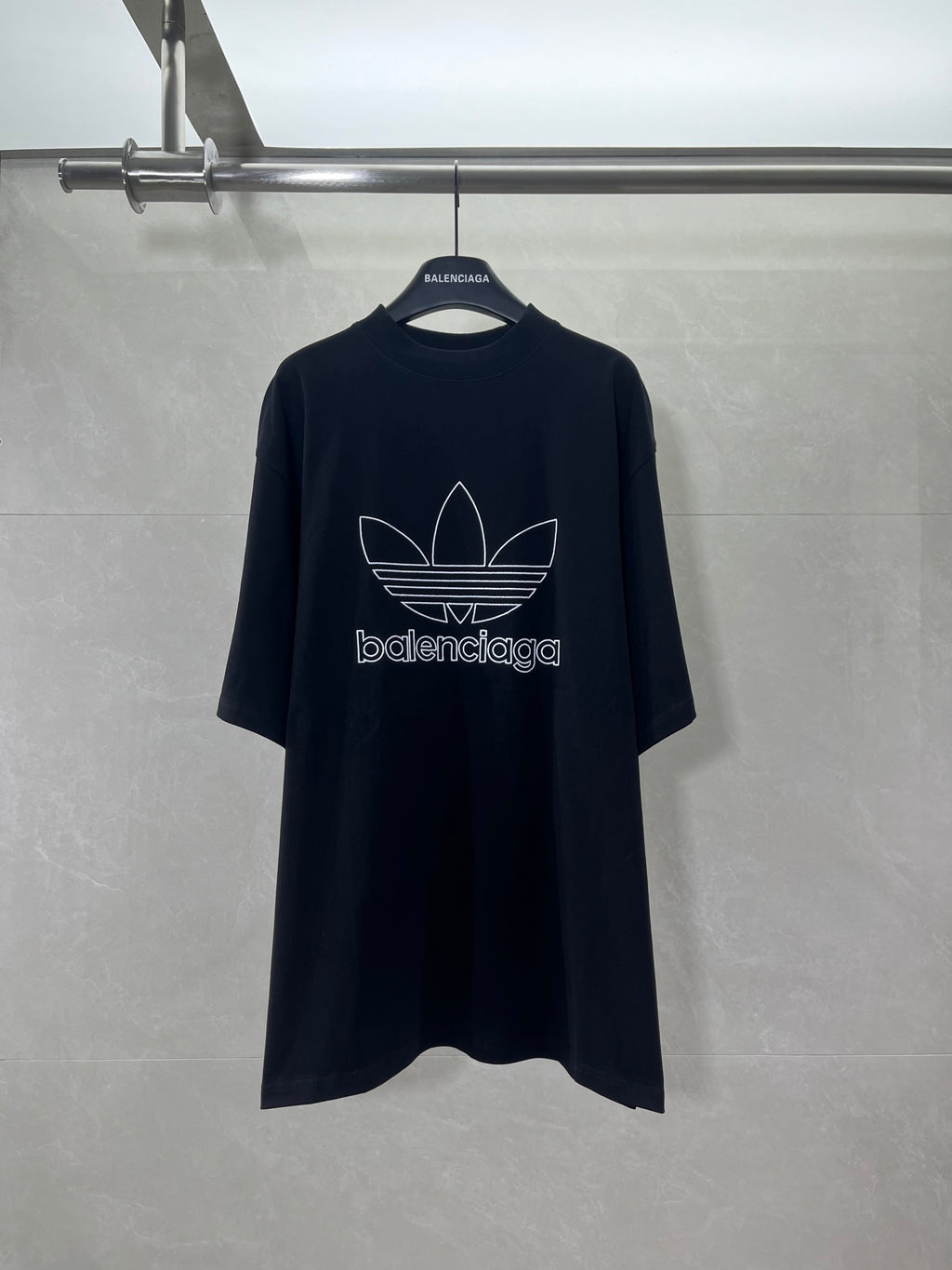 Balenciaga short-sleeve T-shirt in dark color with white trefoil logo on front