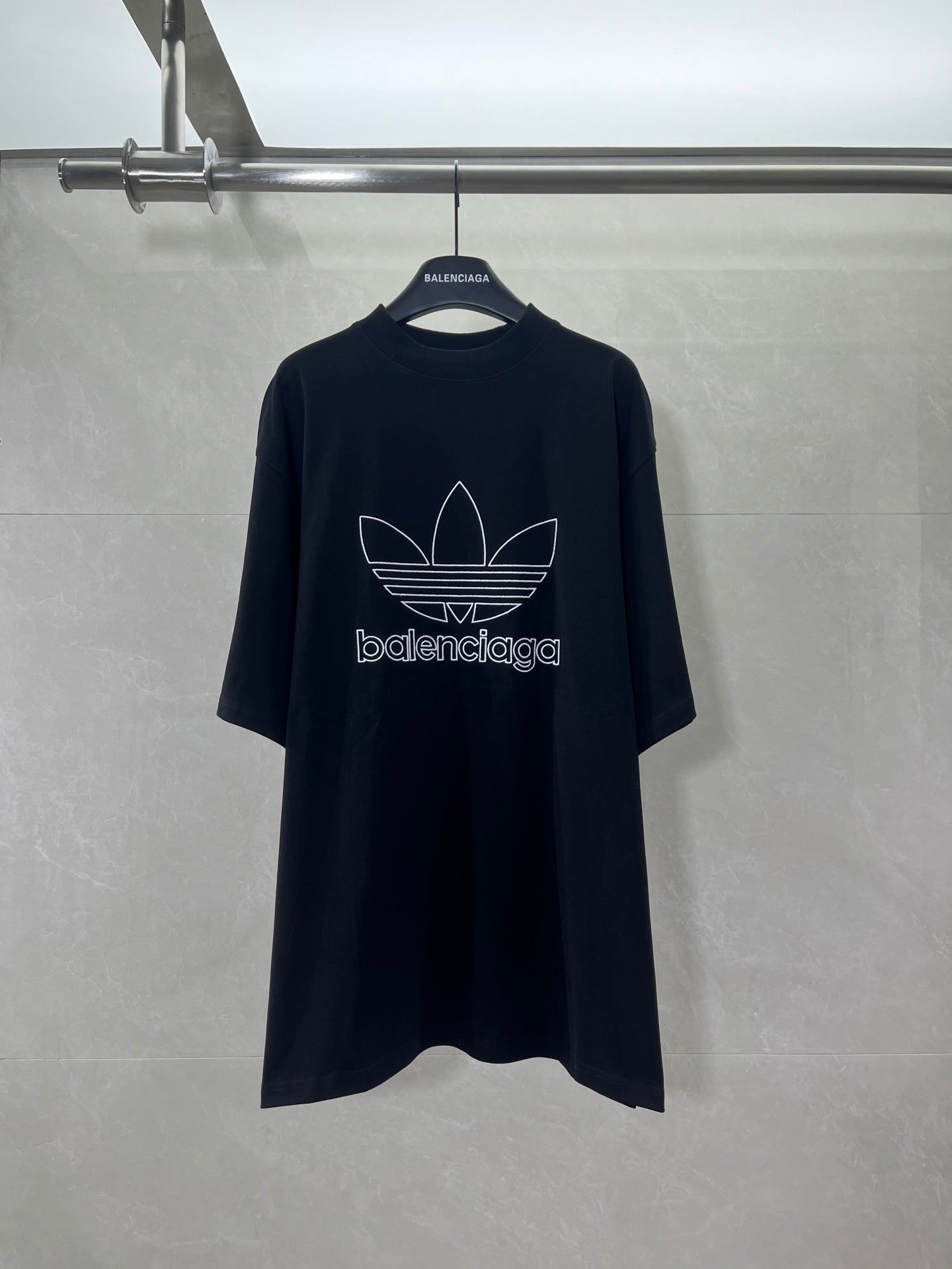 Balenciaga short-sleeve T-shirt in dark color with white trefoil logo on front