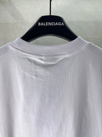 White Balenciaga logo T-shirt, close-up of crew neck and hanging collar view.