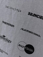 Balenciaga T-shirt fabric close-up with small logo text and circular graphic