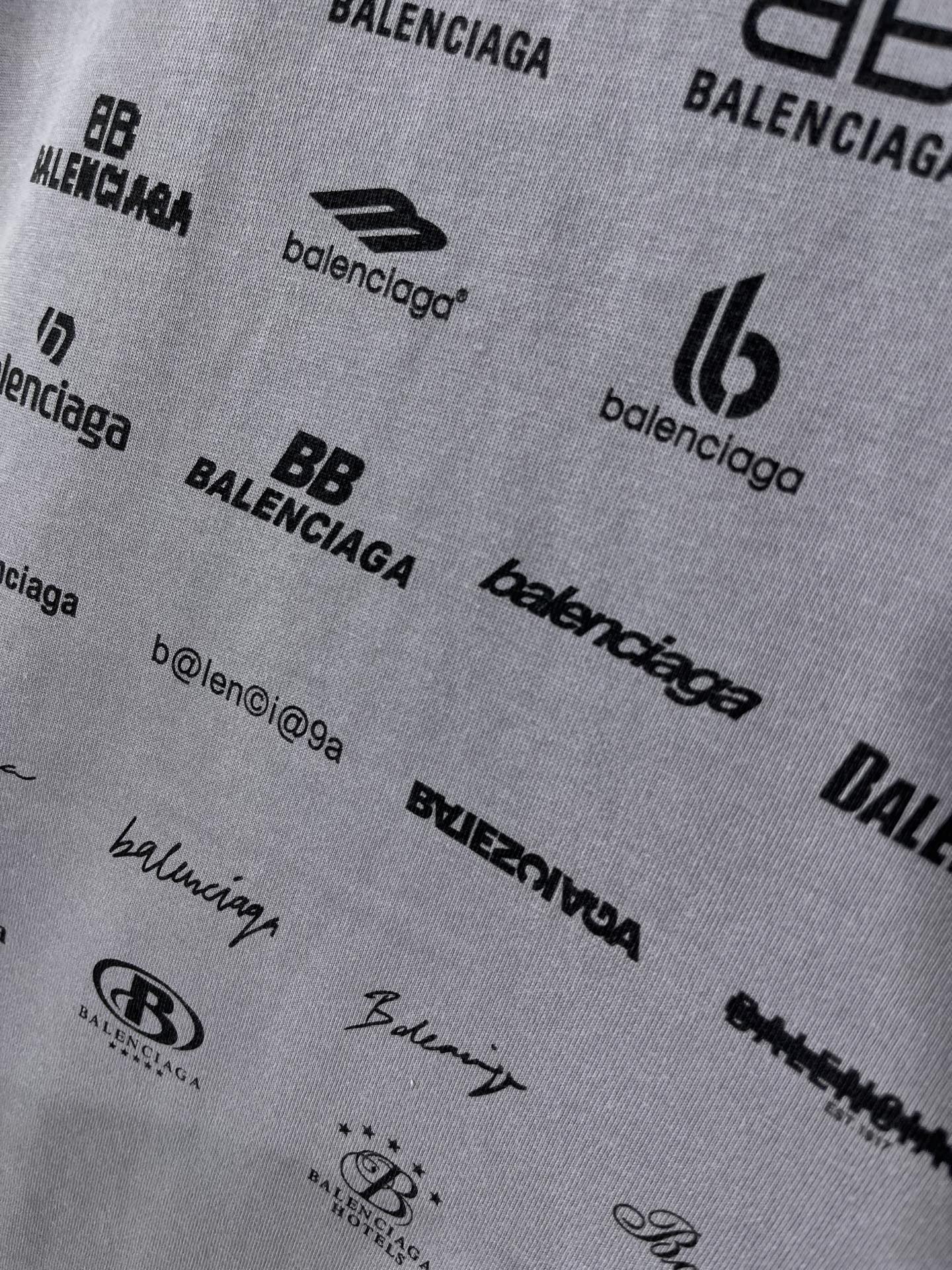 Balenciaga T-shirt fabric close-up with repeated logos and text details