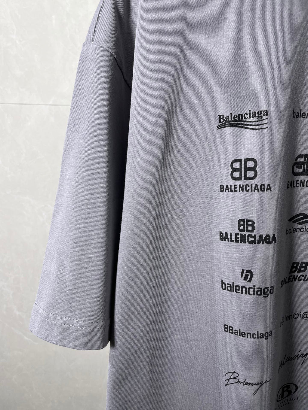 Balenciaga T-shirt side view with logo print and visible hem stitching