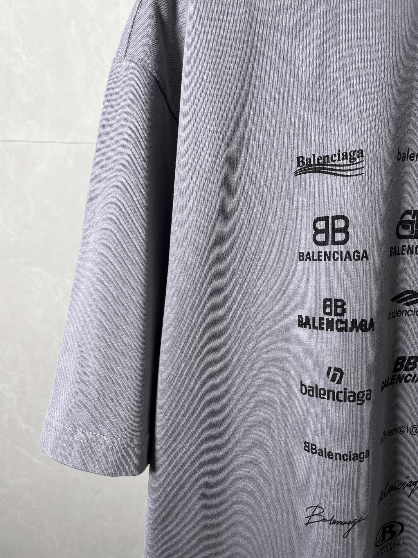 Balenciaga T-shirt side view with logo print and visible hem stitching