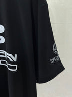 Balenciaga black T-shirt sleeve detail with printed logo and hem